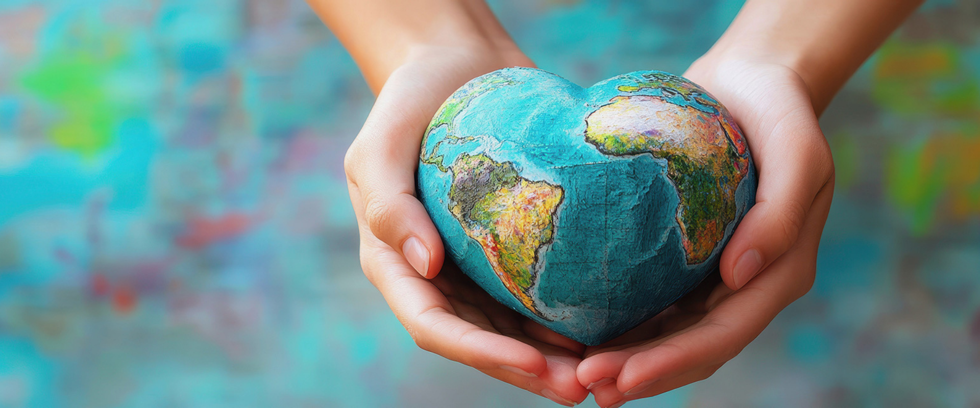 wamgroup social responsibility represented by a heart-shaped earth.